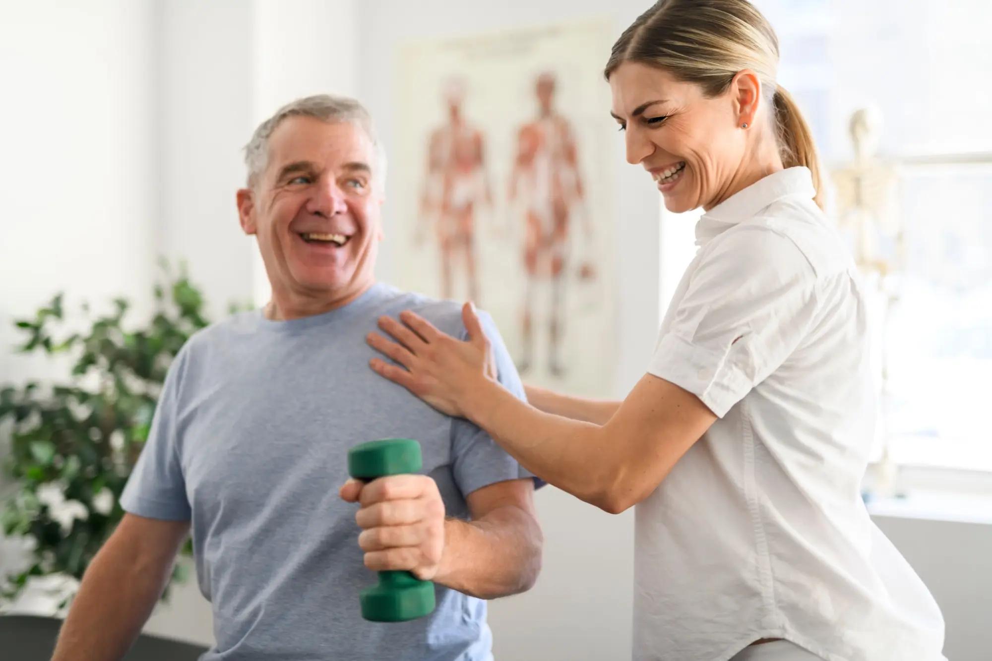 Physical therapist with patient, using Copper HEP